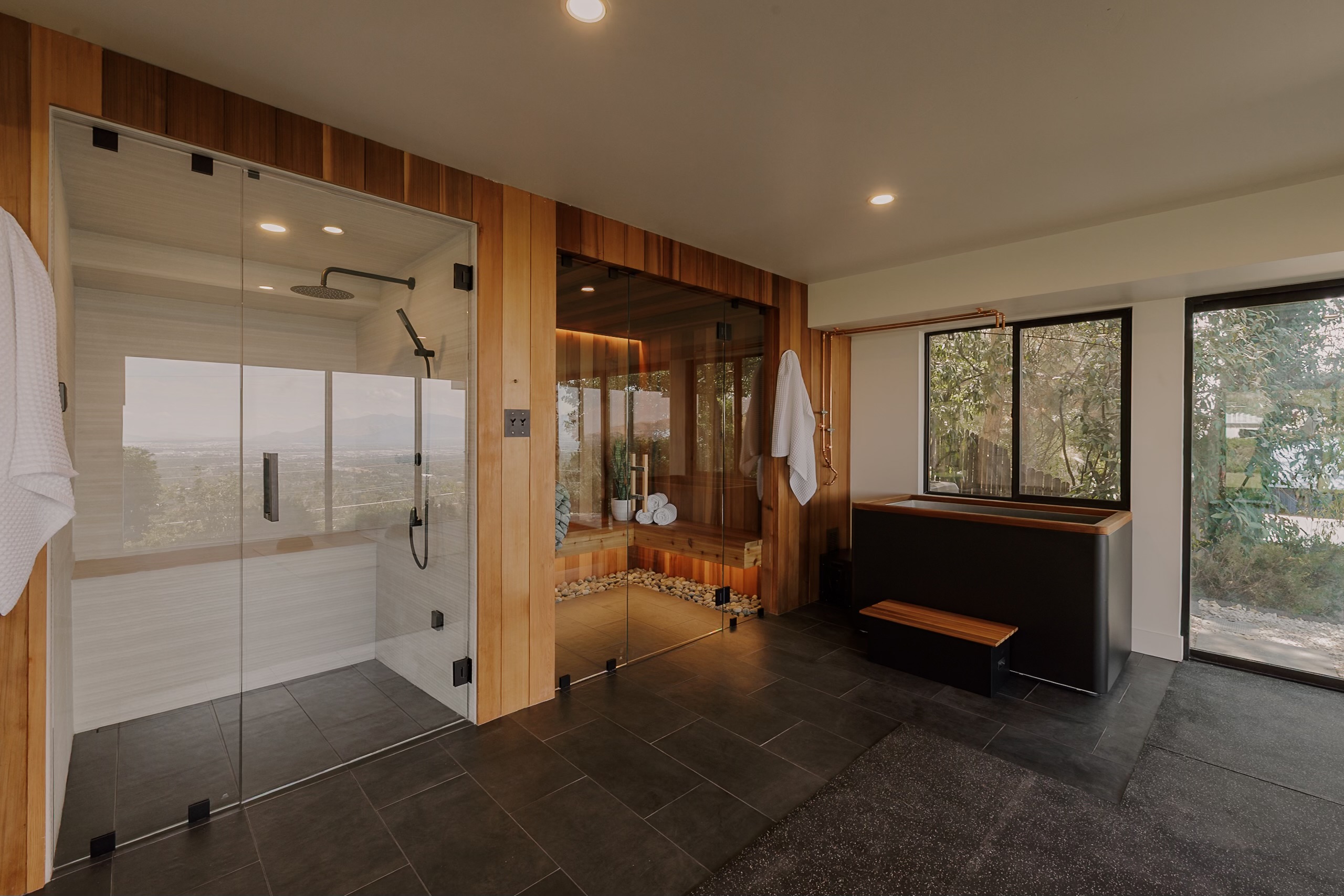 Glass shower, cedar sauna, and cold plunge